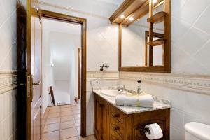 a bathroom with a sink and a mirror at Casa Cordel in Playa Honda +19 photos