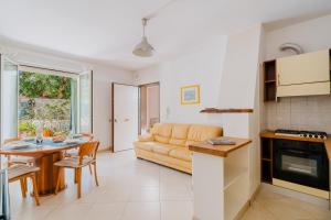 a living room with a couch and a table at Casa vacanze Laura in centro in Otranto +24 photos