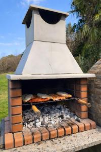 a brick oven with food inside of it at Masia Sa Calma - La Tribu in Susqueda