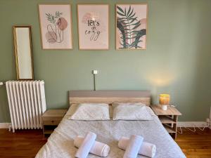 a bedroom with a bed with two pillows on it at Ty Foch in Lorient