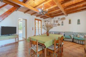 a living room with a table and a couch at Ciumara East in Avola