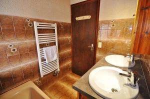 a bathroom with a sink and a toilet and a mirror at Le Mont de Grange in La Chapelle-dʼAbondance