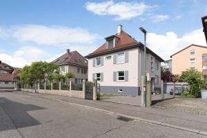 a white house on the side of a street at Haus No 6 in Lahr