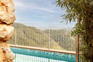 a view of a swimming pool with a view of a mountain at Villa Martina in Pietrasanta