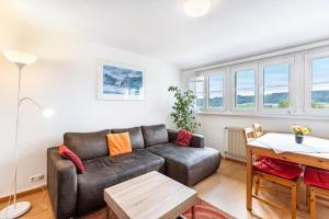 a living room with a couch and a table at Gita in Öhningen
