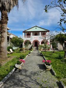 a house with a walkway in front of it at Nana's House Holidays Greece in Dragotiná