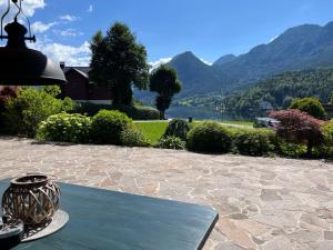 a vase sitting on a table with a view of a lake at Seerhaus in Mosern