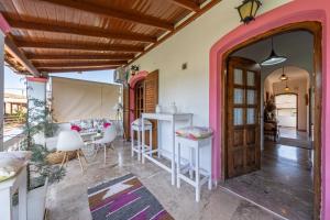an open door to a room with a table and chairs at Nana's House Holidays Greece in Dragotiná