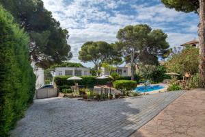 an estate with a swimming pool and trees at Casa Isabel in Calonge