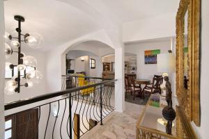 a staircase in a house with a living room at V4 Galeão Vilamoura in Vilamoura