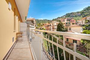 a balcony with a view of a city at Moneglia Mare in Moneglia