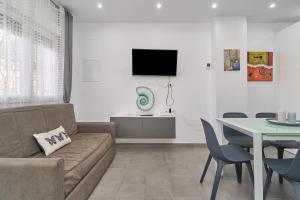 a living room with a couch and a table at Verano Azul in Nerja
