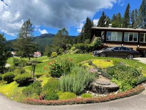 a garden in front of a house at Fewo 2 am Auweg in Hirschegg