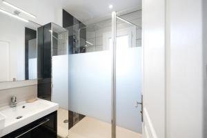 a bathroom with a shower and a sink at Appartement Urrugne in Urrugne