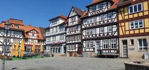 a group of half timbered buildings on a street at Ferienwohnung Landblick in Homberg