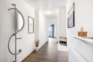 a bathroom with a shower and a hallway at Ferienwohnung Landblick in Homberg +31 photos