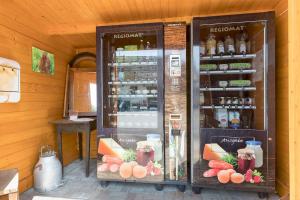 a store with a display case with food and drinks at Ferienhaus Am Sedelbach in Deggenhausertal +18 photos