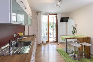 a kitchen with a sink and a counter top at Ferienhaus Am Sedelbach in Deggenhausertal