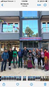 a group of people standing in front of a building at Manakamana hotel in Pāti Bhanjyāng