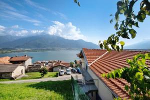 a view of a town with a lake and mountains at Casa Andrea in Gera Lario