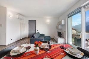 a living room with a table with wine glasses at Casa Andrea in Gera Lario