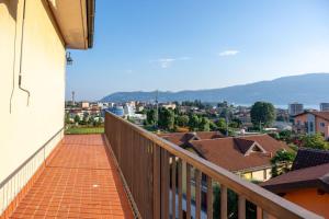 a balcony with a view of a city at Verbania Panorama Lago in Verbania