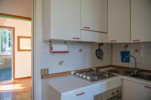 a kitchen with a sink and a counter top at Verbania Panorama Lago in Verbania