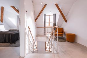 a room with a staircase leading to a bedroom at 4 Personen Apartment 47 in Überlingen