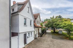 a white house on a cobblestone street at Ferienhaus Feußner in Lauterbach