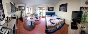 a bedroom with a bed and a table in a room at Ferienwohnung Chiemgau - erleben in Siegsdorf