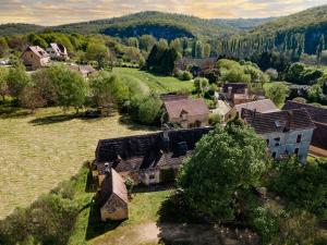 an aerial view of a house in a field at Les Gabernous in Tursac