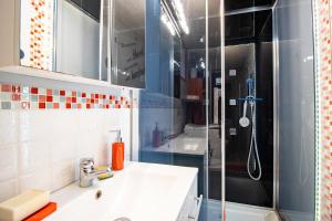 a bathroom with a sink and a shower at Les Gabernous in Tursac +23 photos