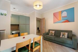 a living room with a table and a couch at Casa Làrisa Lago Maggiore in Laveno-Mombello +20 photos