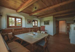 a living room with a table and a couch at Ferienhaus Kaiser in Aßling