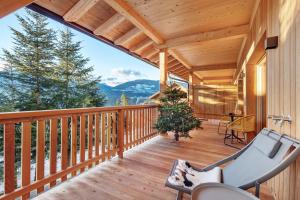 a wooden balcony with a view of the mountains at Lechnerhof - Clara´s Mountain Lodge in Rodengo
