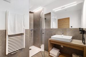 a bathroom with a sink and a shower at Lechnerhof - Clara´s Mountain Lodge in Rodengo +48 photos