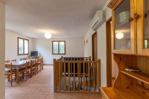 a dining room with a table and chairs at Les Sources Gite Cabernet in Chambonas