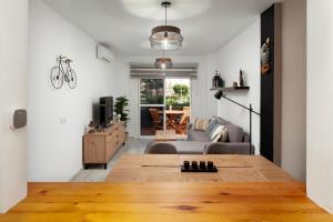 a living room with a couch and a table at Experiencia Marina A107 in Torrox