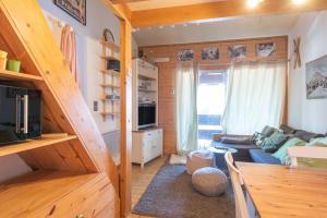 a small living room with a staircase leading to a living room at Appartement 6 pers Piau Engaly in Aragnouet