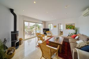 a living room with a couch and a fireplace at Casa Delfin in Moraira