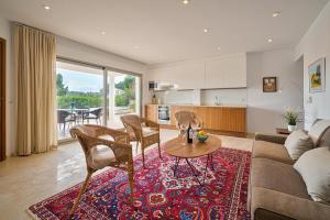 a living room with a couch and a table at Casa Delfin in Moraira