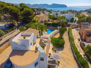 an aerial view of a house with a swimming pool at Casa Delfin in Moraira