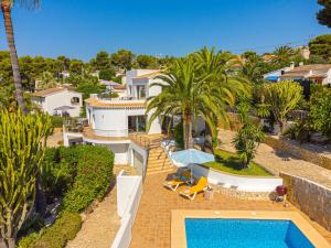 an aerial view of a house with a swimming pool at Casa Delfin in Moraira