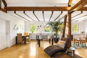 a living room with a ping pong table at Ferienhaus Weitblick in Eslohe