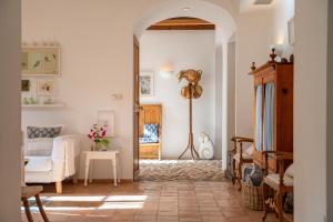 a living room with a white couch and a table at Casa Amber in Sóller