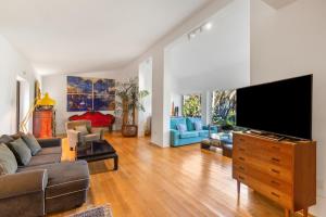 a living room with a large flat screen tv at Finca El Dragonal With Private Pool in Santa Brígida