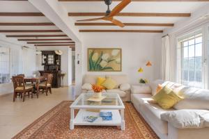 a living room with a couch and a table at Casa Can Mussenya in Illes Balears