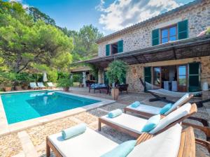 an image of a villa with a swimming pool at Sa Cala in Deia