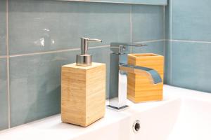 a bathroom sink with a faucet on top of it at Suite Le Cementine in Mottola +22 photos