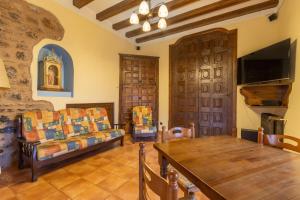 a living room with a couch and a table at Casa Vilanova in Peramea